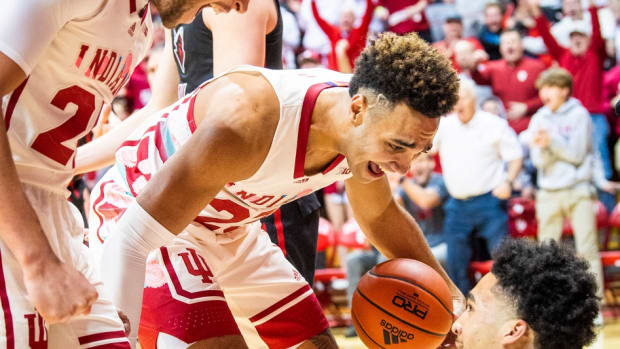Race Thompson (25) and Trayce Jackson-Davis (23) congratulate Jalen Hood-Schifino (1) for a basket and getting fouled during their matchup with Rutgers.
